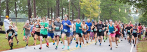 Picture of many people participating in a 5-kilometer run and walk event on Springdale road in Camden, SC.