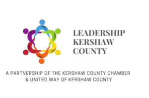 The Leadership Kershaw County Logo features a circle with six people holding hands, each wearing a different color such as blue, green, yellow, orange, red, and purple. To the right of the circle, the words "Leadership Kershaw County" are written.