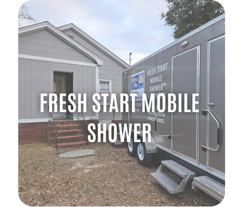 A mobile shower trailer is parked outside a house with steps and a small porch. Text reads Fresh Start Mobile Shower.