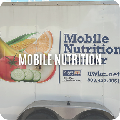 A trailer with images of produce and text reading Mobile Nutrition Center, uwkc.net, and a phone number.