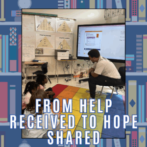 A teacher reads to young students seated on a colorful rug in a classroom with From help received to hope shared text.